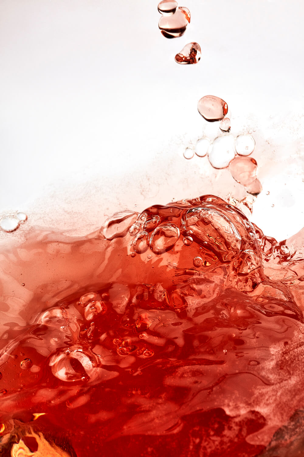 vintage rosé Champagne flowing in a glass