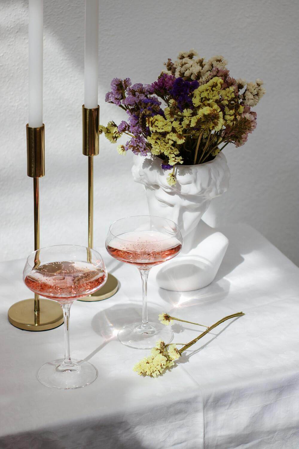glasses of rosé on a set table